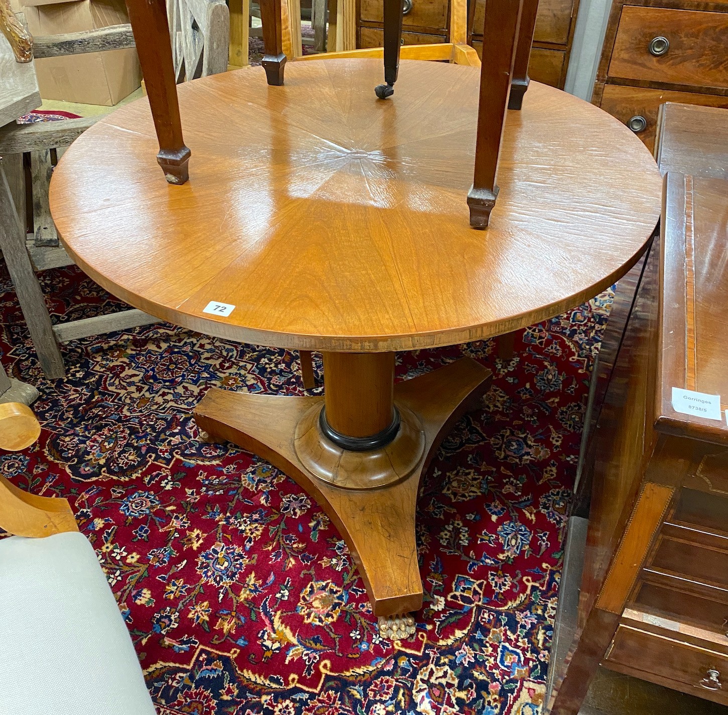 A Biedermeier style circular breakfast table, diameter 91cm, height 75cm, and a pair of elbow chairs